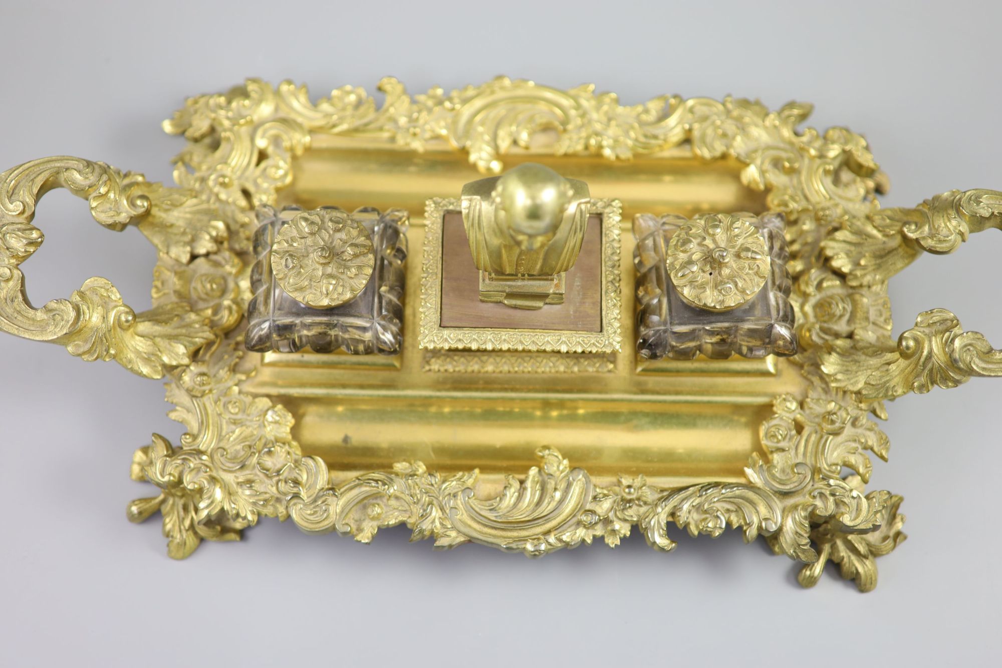 A Victorian ormolu ink stand, width 17.5in. depth 9in. height 6in.